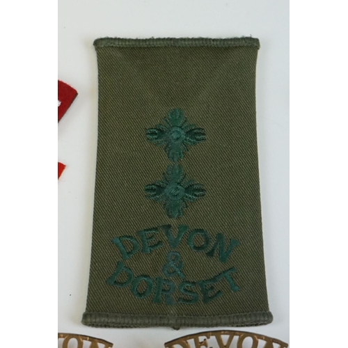 23 - A Collection Of Fourteen British Military The Devon & Dorset Regiment Badges To Include Shoulder Tit... 