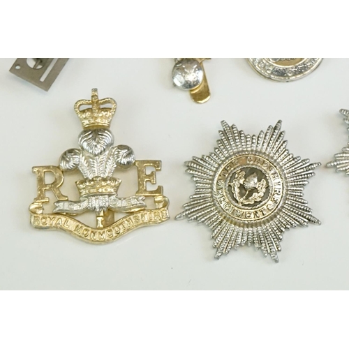 56 - A Small Collection Of Militaria To Include A Royal Monmouthshire Regiment Cap Badge, A Royal Electri... 