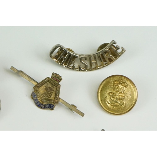 56 - A Small Collection Of Militaria To Include A Royal Monmouthshire Regiment Cap Badge, A Royal Electri... 