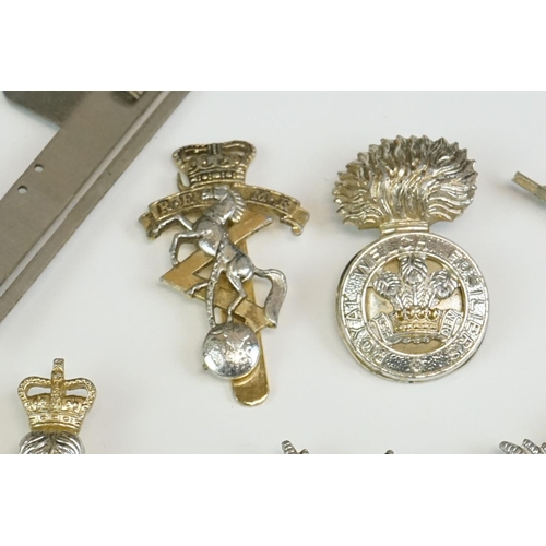 56 - A Small Collection Of Militaria To Include A Royal Monmouthshire Regiment Cap Badge, A Royal Electri... 