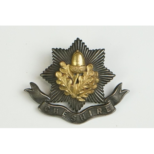 61 - A Collection Of Three British The Cheshire Regiment Cap Badges To Include A White Metal Two Piece Ex... 