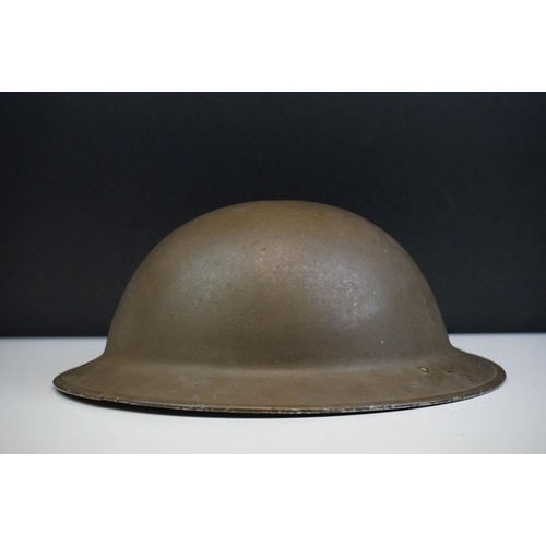 142 - A British World War Two Brodie Helmet Together With A World War Two Trench Art Money Box Made From A... 