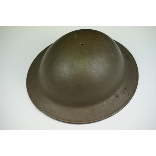 142 - A British World War Two Brodie Helmet Together With A World War Two Trench Art Money Box Made From A... 