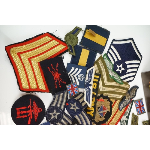 148 - A Collection Of Military Cloth Badges To Include Trade Badges, Stripes...etc.. Contained Within A Mi... 