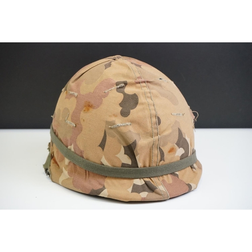 221 - A British Military Helmet Complete With Liner And Desert Camouflage Cover.