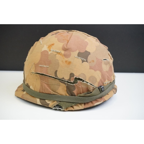 221 - A British Military Helmet Complete With Liner And Desert Camouflage Cover.