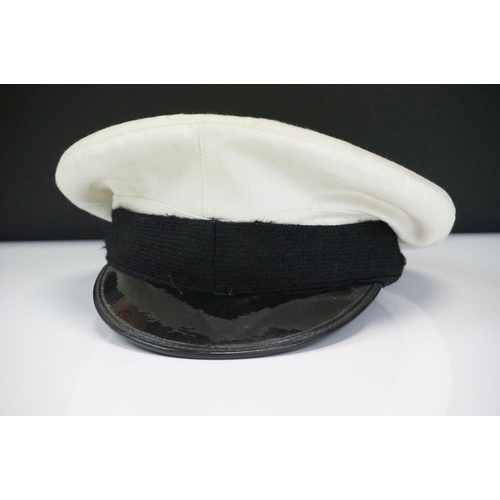 229 - A Mixed Collection Of Militaria To Include A British Royal Navy Female Officers Cap, Two Male Navy C... 