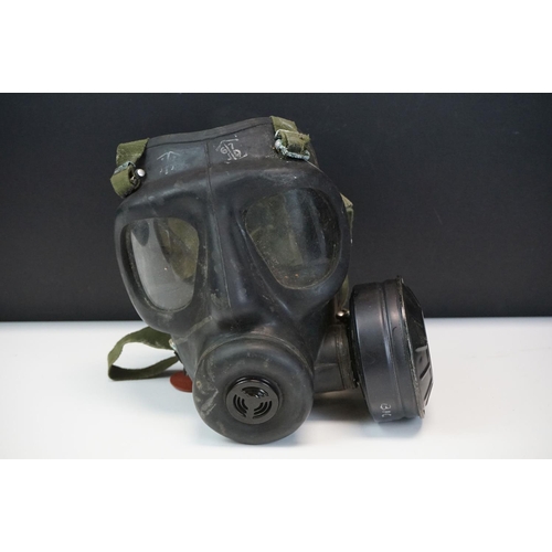 230 - A British Military Respirator With Soldiers Dog Tag Together With A Group Of Similar.