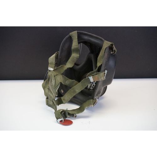 230 - A British Military Respirator With Soldiers Dog Tag Together With A Group Of Similar.