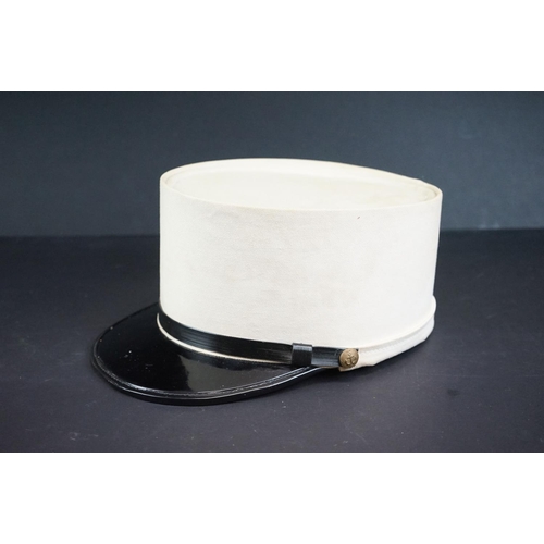 210A - A French Foreign Legion Kepi Hat With Neck Flap And Brass Anchor Buttons.