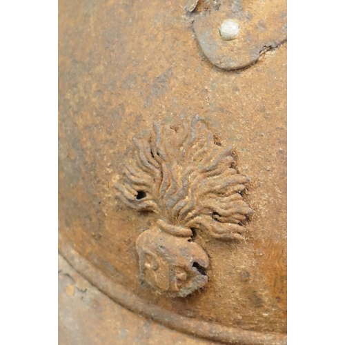 220A - An Original French M15 Helmet With Original Badge And Liner, In Battlefield Relic Condition.