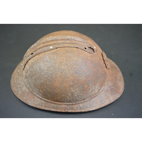 220A - An Original French M15 Helmet With Original Badge And Liner, In Battlefield Relic Condition.