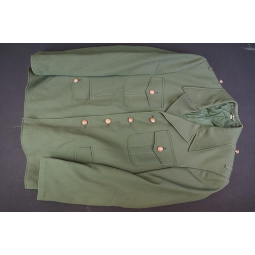 235 - A Large Collection Of Mixed Military Uniforms To Include British Battle Dress Trousers.