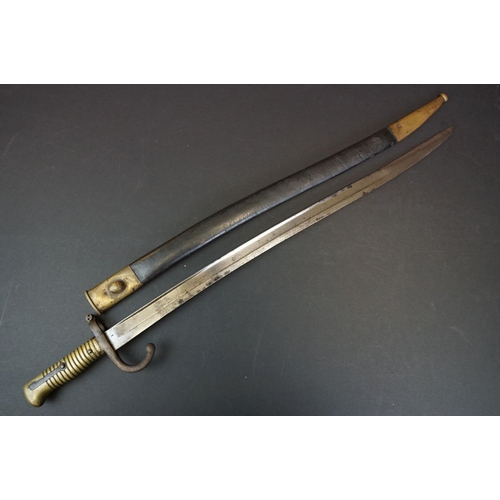 371 - A Pre World War One Sword Bayonet With Brass Handle And Hooked Quillion, Complete With Original Scab... 