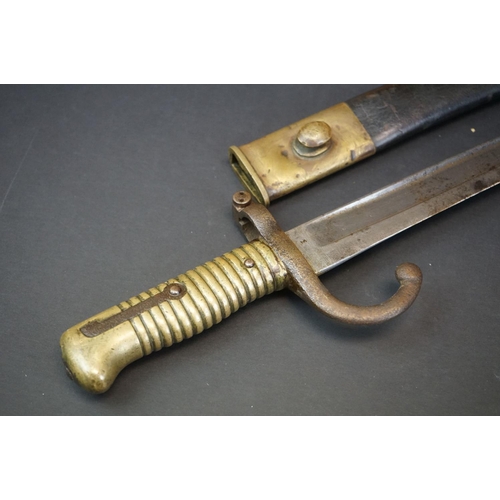 371 - A Pre World War One Sword Bayonet With Brass Handle And Hooked Quillion, Complete With Original Scab... 