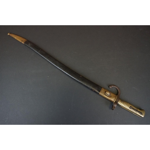 371 - A Pre World War One Sword Bayonet With Brass Handle And Hooked Quillion, Complete With Original Scab... 