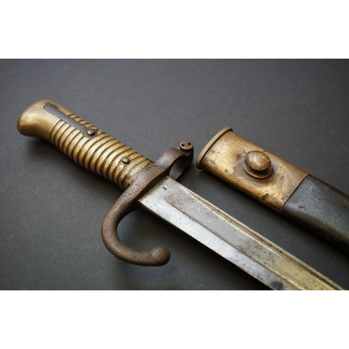 371 - A Pre World War One Sword Bayonet With Brass Handle And Hooked Quillion, Complete With Original Scab... 