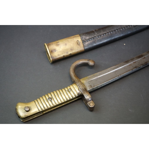 371 - A Pre World War One Sword Bayonet With Brass Handle And Hooked Quillion, Complete With Original Scab... 