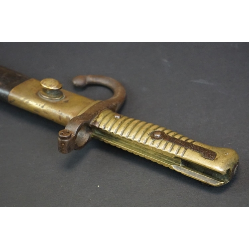 371 - A Pre World War One Sword Bayonet With Brass Handle And Hooked Quillion, Complete With Original Scab... 