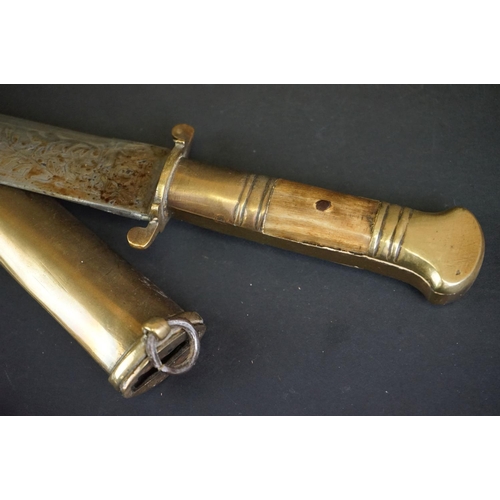 373 - Two Islamic Daggers With Decoratively Engraved Blades, Horn / Bone Handles And Brass Scabbards.