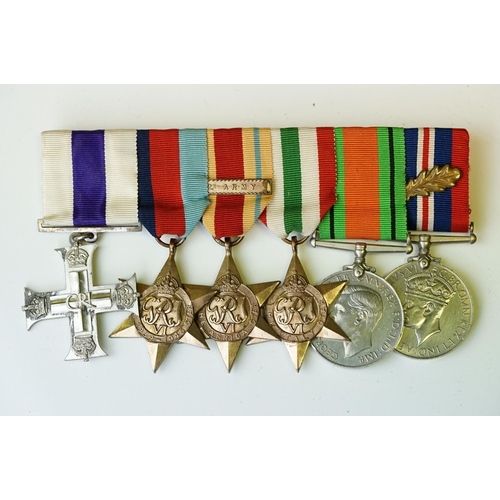 136 - A British World War One & World War Two Family Medal Group To Include Two Military Cross Medals. The... 