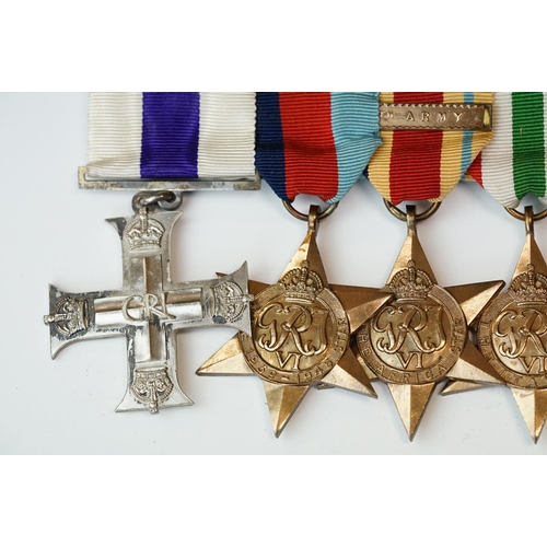 136 - A British World War One & World War Two Family Medal Group To Include Two Military Cross Medals. The... 