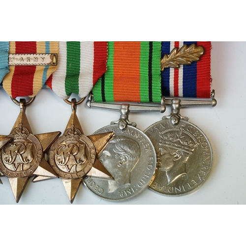 136 - A British World War One & World War Two Family Medal Group To Include Two Military Cross Medals. The... 