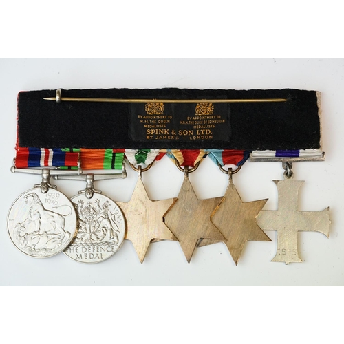 136 - A British World War One & World War Two Family Medal Group To Include Two Military Cross Medals. The... 