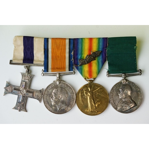 136 - A British World War One & World War Two Family Medal Group To Include Two Military Cross Medals. The... 