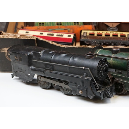 106 - Four O gauge locomotives to include 2 x Marx (New York Central & 1666 Penn Central examples both in ... 