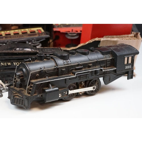 106 - Four O gauge locomotives to include 2 x Marx (New York Central & 1666 Penn Central examples both in ... 