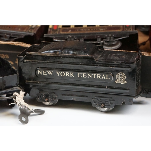 106 - Four O gauge locomotives to include 2 x Marx (New York Central & 1666 Penn Central examples both in ... 