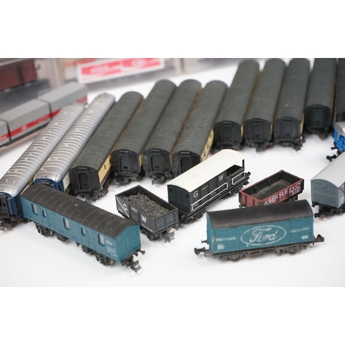 96 - Over 55 cased and uncased N gauge items of rolling stock to include Peco, Fleischmann, Trix etc, fea... 