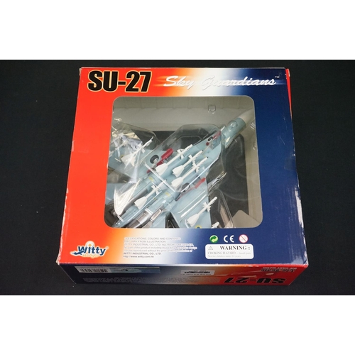 1033 - Four boxed 1/72 Witty Wings diecast models to include SU-27, F-15, Polish Air Force MiG-29UB & MI 17... 