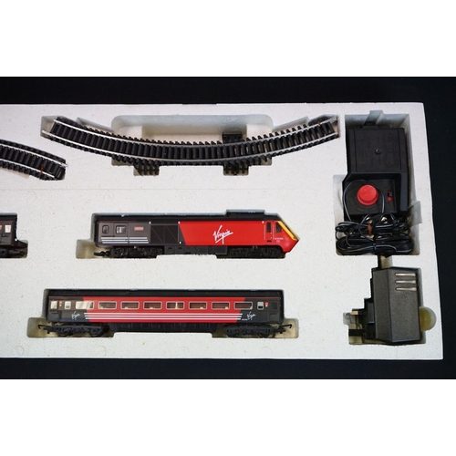 164 - Two boxed Hornby OO gauge electric train sets to include R1004 The Duchess and R1011 Virgin Trains 1... 