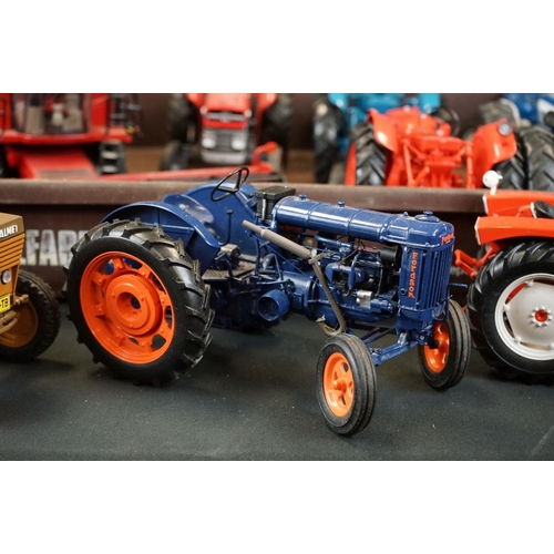 1064 - Nine diecast farming models featuring mainly Universal Hobbies tractors and a Britains Case 8120 Com... 