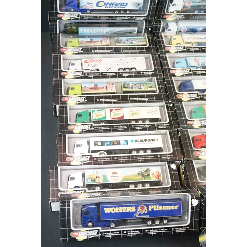 1067 - 34 Boxed Dickie Spielzeug Truck Stop diecast models to include double trailer, trucker service and i... 