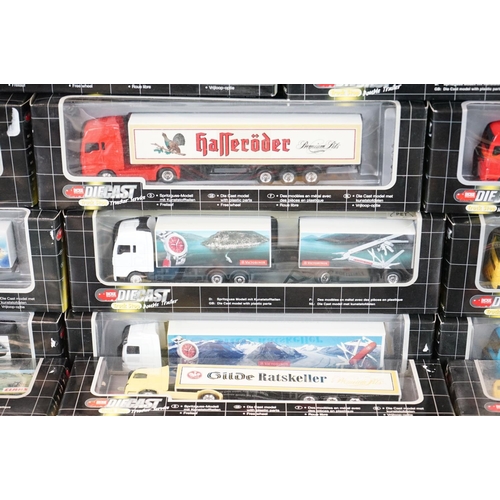 1067 - 34 Boxed Dickie Spielzeug Truck Stop diecast models to include double trailer, trucker service and i... 