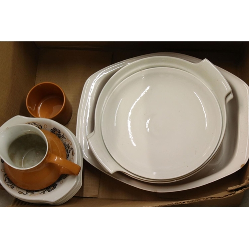 106 - Poole Pottery Dinner and Tea Ware decorated in two tone orange and white ground with a floral patter... 