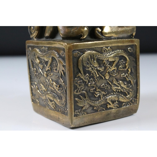 148 - Large Chinese Bronze Seal surmounted by dragons, 14cm high