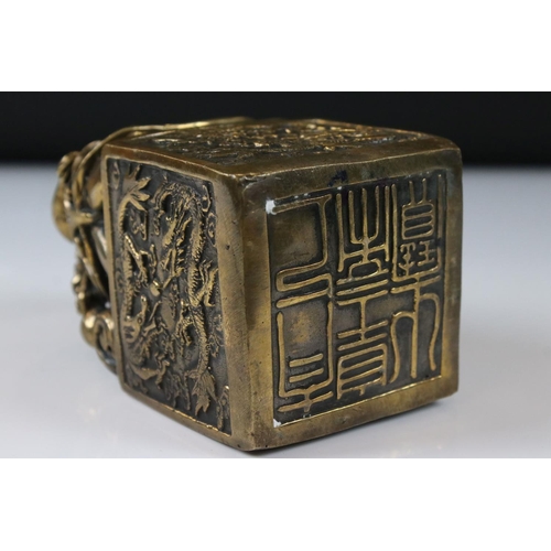 148 - Large Chinese Bronze Seal surmounted by dragons, 14cm high