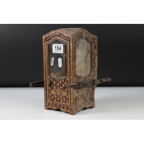 154 - 19th / Early 20th century Novelty Table Vitrine in the form of a Tooled Gilt Leather covered Sedan C... 