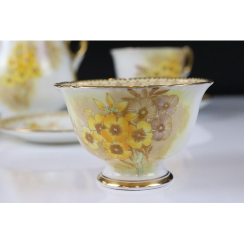 16 - Shelley Tea for Two Set, gilt and yellow flower decoration, comprising Tea Pot, Two Tea Cups, Two Sa... 