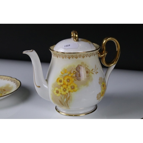 16 - Shelley Tea for Two Set, gilt and yellow flower decoration, comprising Tea Pot, Two Tea Cups, Two Sa... 