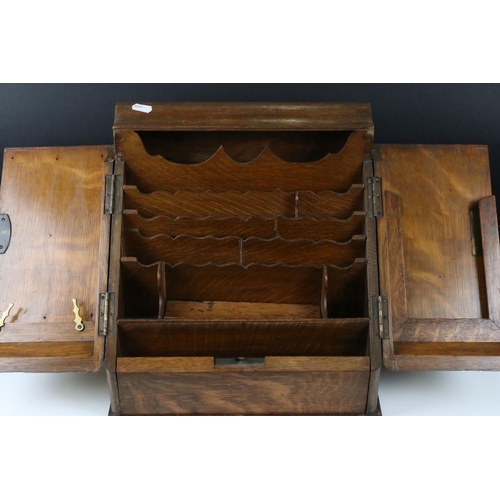 163 - Victorian Oak Stationery Cabinet, the pair of sloping doors opening to a fitted interior, drawer to ... 