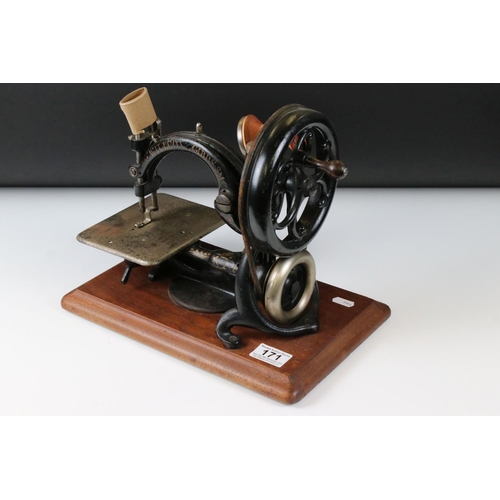 171 - Late 19th / Early 20th century Wilcox & Gibbs Hand Operated Sewing Machine, 25cm high