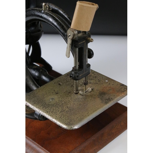 171 - Late 19th / Early 20th century Wilcox & Gibbs Hand Operated Sewing Machine, 25cm high