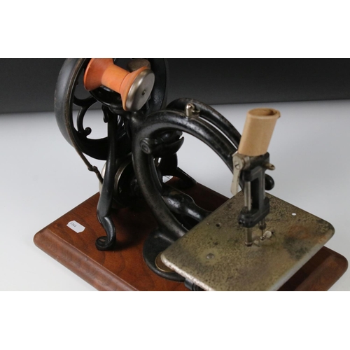 171 - Late 19th / Early 20th century Wilcox & Gibbs Hand Operated Sewing Machine, 25cm high