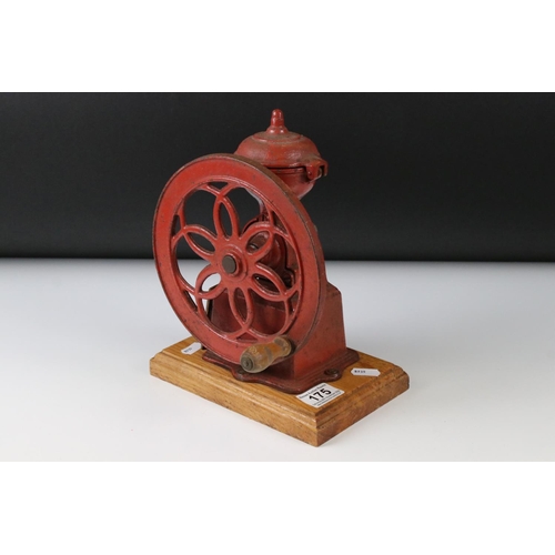 175 - Early to Mid 20th century Red Cast Iron ' National ' Coffee Grinder mounted on a wooden base, 23cm h... 