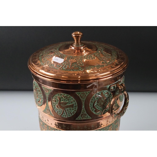 183 - Copper Lidded Urn with engraved Persian / Zoroastrian type decoration, two ringed handled, 35cm high